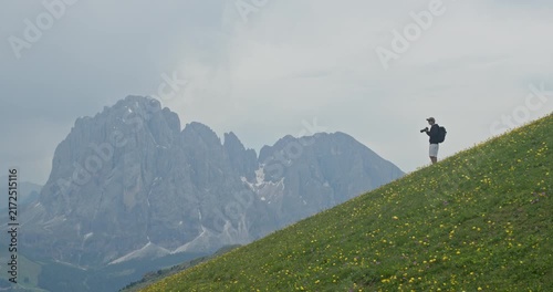 Photographer capturing amazing mountain landscape in the dolomites