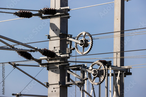 Railway overhead line mast with insulators and tension wheels