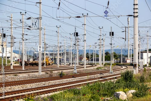 Curving railway tracks with overhead catenary wires