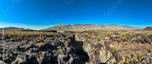 A UAV Drone view of the Fossil Falls Cinder Cone Red Hill Area on US 395 in the Owens Valley left over from vulcanism that built the Sierra Nevada mountain Range looking at the Fossil Falls Obsidian 