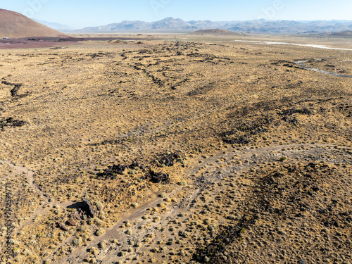 A UAV Drone view of the Fossil Falls Cinder Cone Red Hill Area on US 395 in the Owens Valley left over from vulcanism that built the Sierra Nevada mountain Range looking at the Fossil Falls Obsidian 