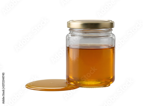 Hyper-realistic unbranded glass jar of golden natural honey beside a glossy honey pool, isolated as a clean transparent food cutout.
