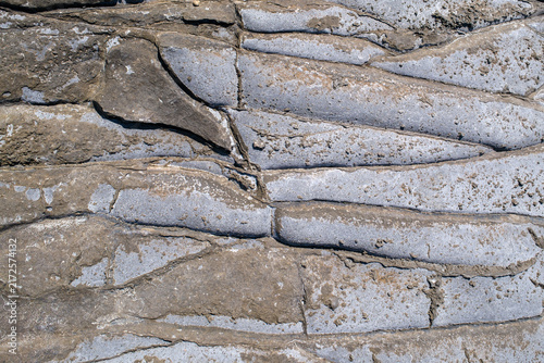 Layered Volcanic Rock Texture with Natural Cracks and Geological Formation