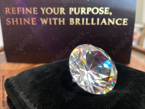 Obraz na płótnie Brilliant Diamond Gemstone Reflecting Light on Dark Surface