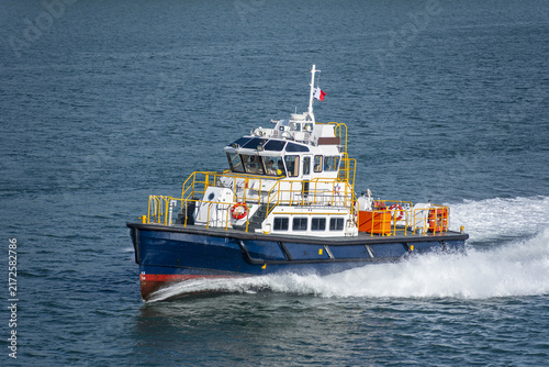 Fast pilot boat cruising across a calm ocean surface with the Panamanian flag clearly visible.