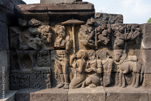 Fotografie Borobudur temple stone relief carving depicting ancient figures