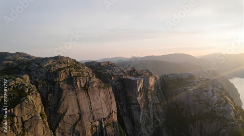Panoramic view of rugged mountain range under soft morning light
