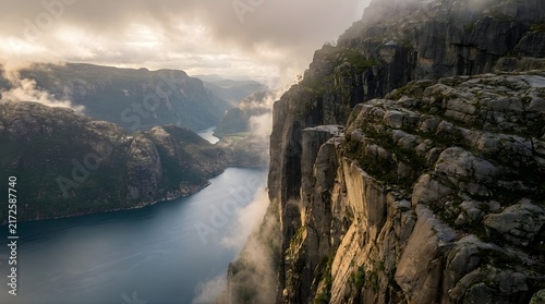 Scenic river flowing through steep rocky canyon at sunset
