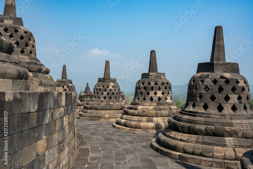 Quadro su tela Borobudur temple stupas against blue sky in java