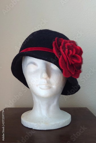 vintage black felt cloche hat with red rose evoking flapper, Gatsby, speakeasy era