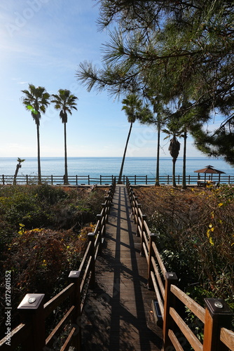 seaside walkway and gazebo in winter sea