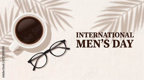 A top-down conceptual background for International Men's Day featuring a cup of black coffee, modern glasses, and palm leaf shadows on a neutral beige texture.