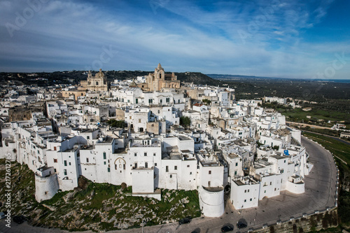 Aerial View of Ostuni's White City with Cathedral Dome Under Blue Sky