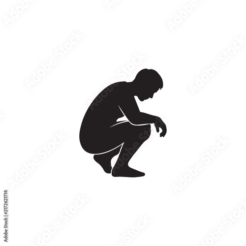 Black silhouette of a depressed man crouching down in a posture of sadness and solitude with depression crouching silhouette loneliness negative emotions isolated suffering thinking solitude
