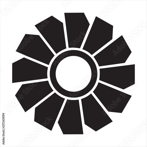 This circular black symbol features ten broad, outward pointing elements arranged around a central ring