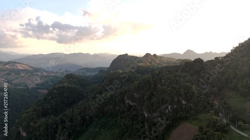 4k Aerial video of a village in a beautiful valley and forest.	