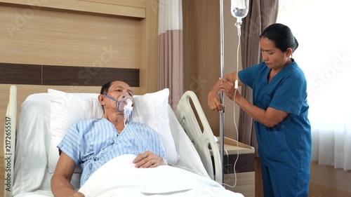 Elderly patients wear oxygen machines to help them breathe. Patients use portable oxygen machines in hospitals. Patients with respiratory problems. (VDO 4K)	
