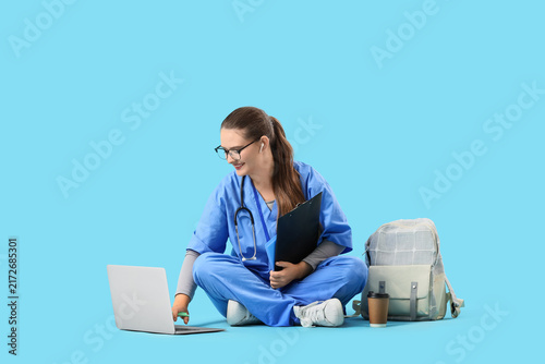 Medical education and remote learning, student nurse using laptop for online ...