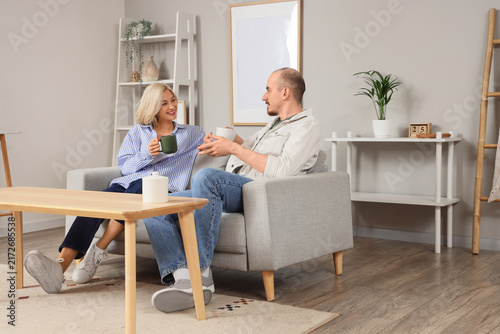 Work-life balance and relationship bonding, happy couple talking and drinking...