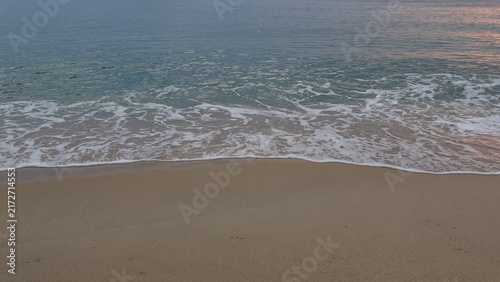 Sticker Calm Ocean Waves Reaching the Sandy Shore