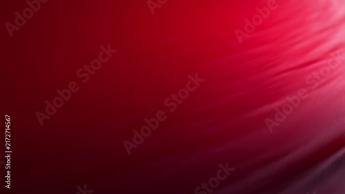 Smooth red fabric waves flowing in slow motion abstract background for creative projects