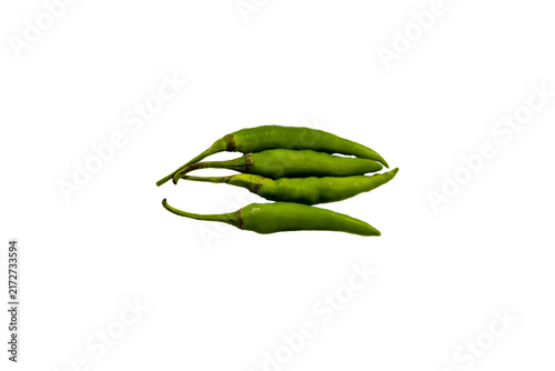 Принти на полотні Stack of fresh, raw green chili peppers isolated on a light yellow background, h