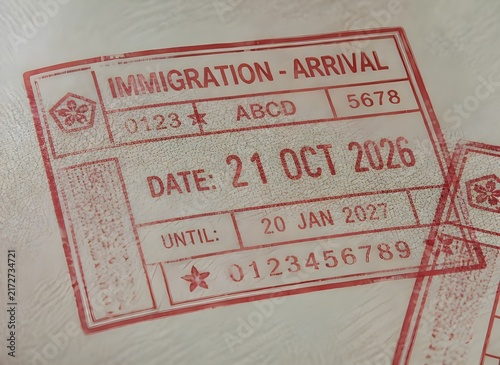 Close Up of Red Immigration Arrival Stamp with Date inside Passport Page