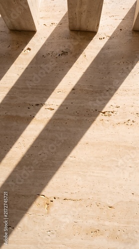 Vertical Warm Beige Travertine Surface with Soft Directional Shadows