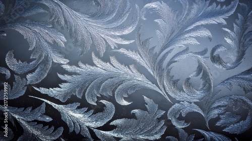 Elegant abstract frost patterns on glass with intricate crystalline swirls.