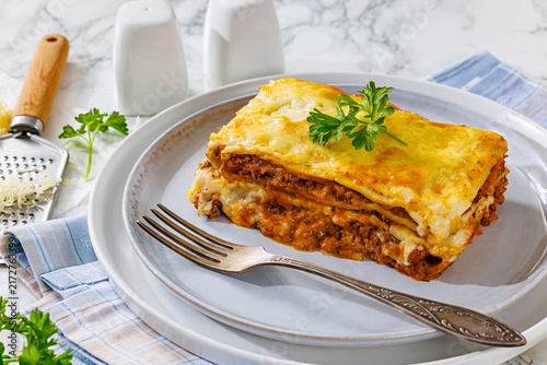 Fotografie Meat lasagna portion with minced beef, cheese