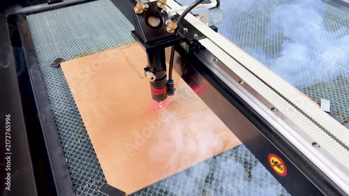 Laser cutting machine. The laser cuts the details. Automation and precision system. Modern industrial technology. Industrial laser engraving machine. Cnc laser head. 