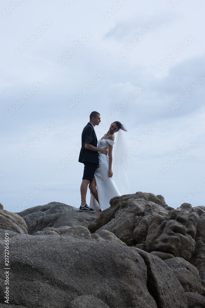 Obraz premium Bride Smiling Over Shoulder Wind Blown Veil Ko Samui