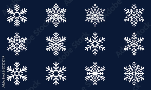 White snowflakes seamless pattern on dark blue background vector illustration. Flat cartoon winter holiday snowfall ornament design