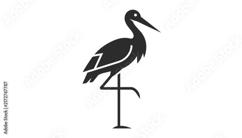 Elegant silhouette of a stork bird standing on one leg in a side profile view isolated on a white background.