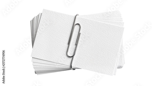 Fotografía Stack of textured white paper notes held together by a silver paperclip, isolate