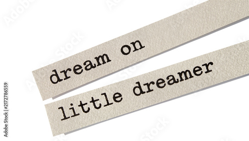 Картината върху платно Two paper strips with typed text dream on and little dreamer , isolated on trans