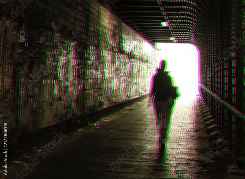 Принти на полотні Abstract digital illustration of a lonely silhouette in a dark tunnel with chromatic aberration