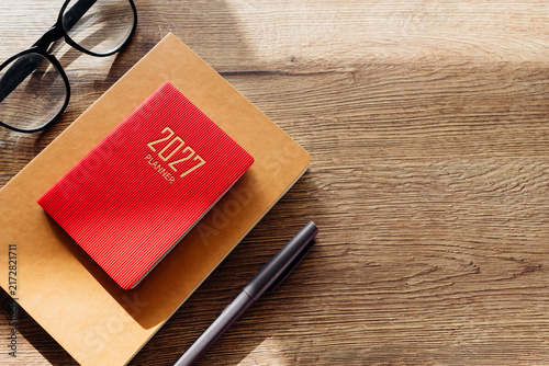 Planning 2027 new year goals with a red planner