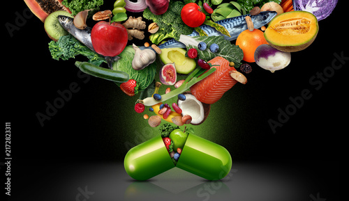 Dietary Food Supplement as a capsule with fruit vegetables nuts and beans inside a nutrient pill as a natural medicine health treatment on a clack background.