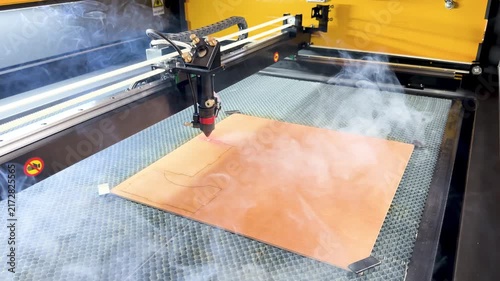 Laser cutting machine. The laser cuts the details. Automation and precision system. Modern industrial technology. Industrial laser engraving machine. Cnc laser head.
