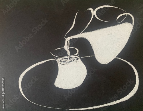 Milk pours from a pitcher into a glass. A healthy drink for children and adults.