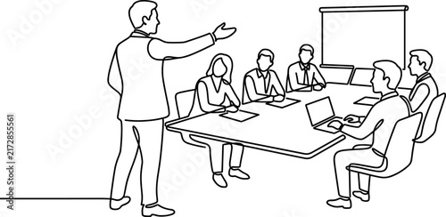 Business Meeting Presentation Speaker Addressing Team Around Conference Table with Laptops