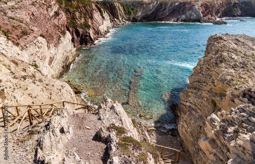 Scenic descent leading to the beautiful Cala Maidduzza cove in Terrasini, province of Palermo, Sicily, Italy.