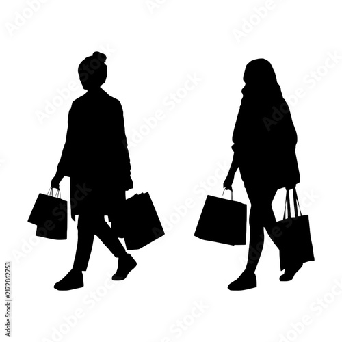 Foto Silhouette couple walking with shopping bags