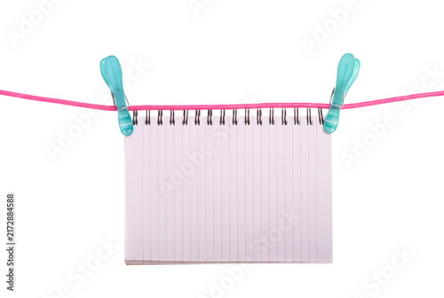 Fotografía White Spiral Notepad Hanging on Pink Clothesline with Teal Clips