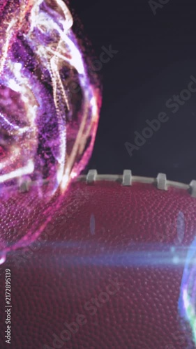 Animation of lens flare and multicolored abstract pattern over rugby ball against black background