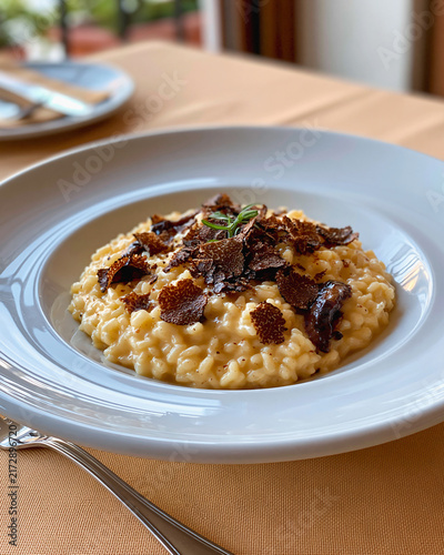 Truffle Risotto Perfection Creamy, rich risotto crowned with delicate shavings of black truffle, a testament to culinary artistry.