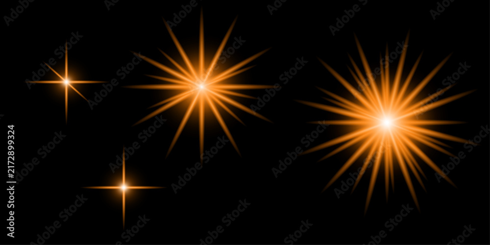 Fototapeta premium Set of glowing orange star bursts and sparkling light effects isolated on a solid black background