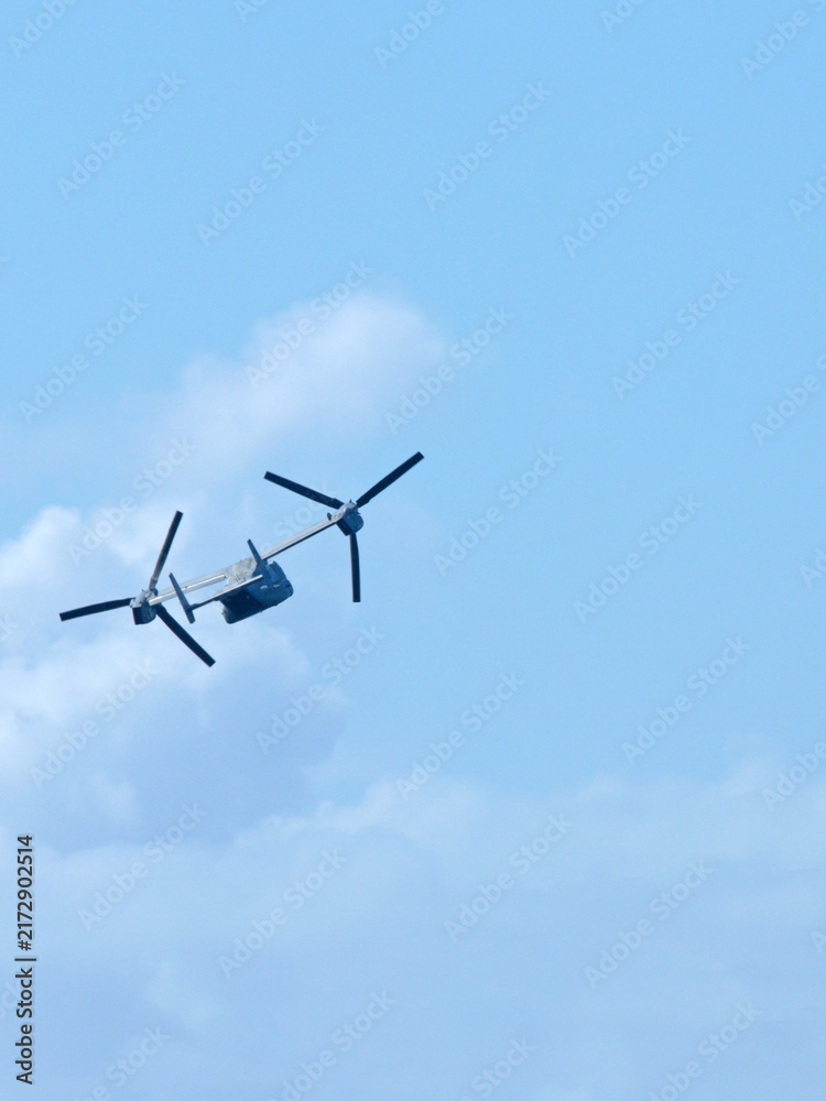 Fototapeta premium Military Tiltrotor Aircraft Flying in Blue Sky at Gold Coast Airshow