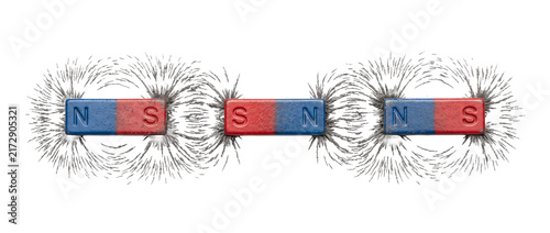 Bar magnet magnetic field lines showing physical force with iron filings on black background for physics science education experiment, polarity attraction repulsion concept studio shot